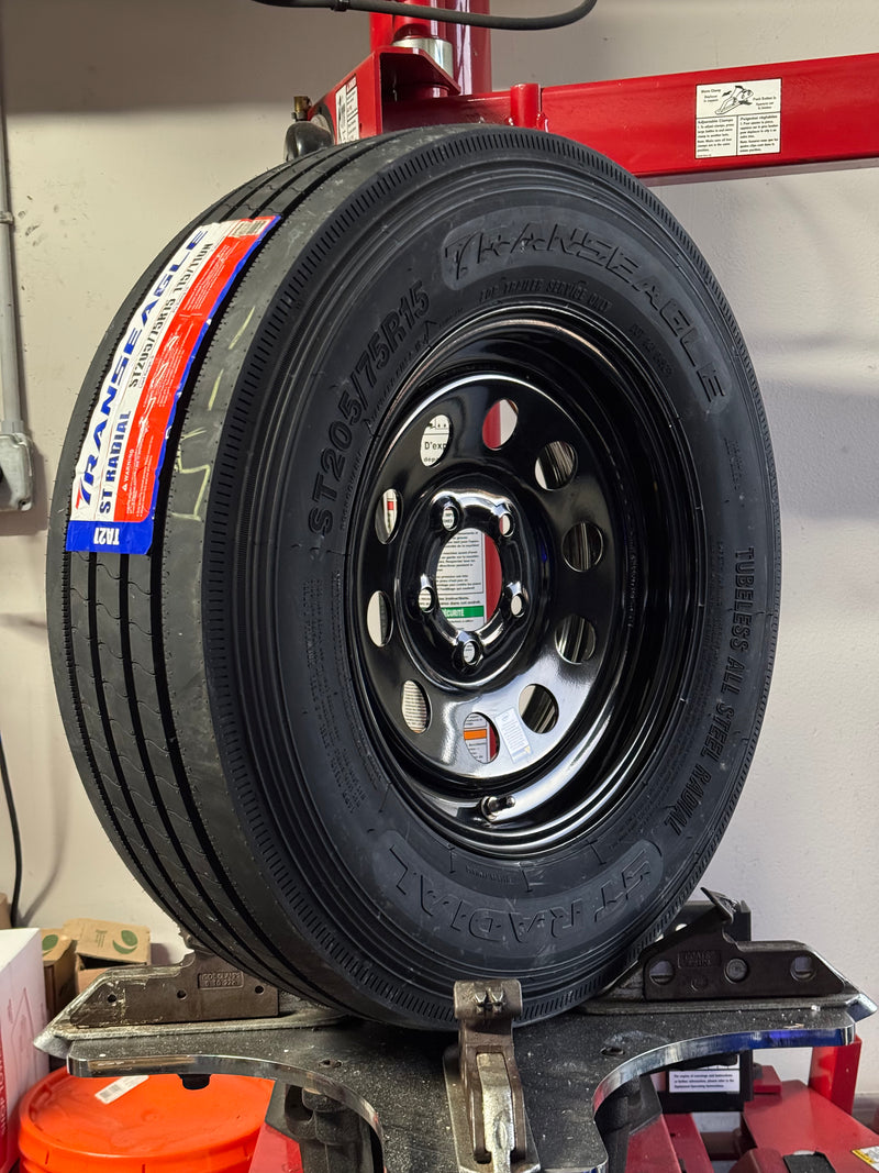 ST205/75R15 14-Ply Trailer Tire on 15" 5-4.5 Black Modular Wheel
