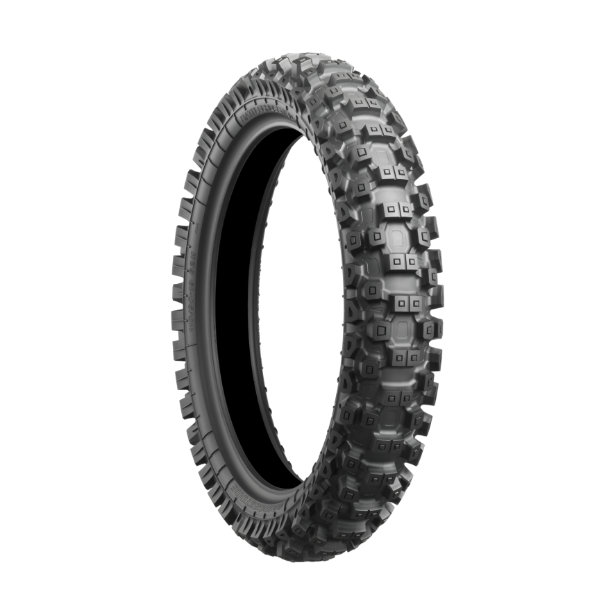 Bridgestone Battlecross X30 rear dirt bike tire with aggressive blocky tread for intermediate off-road traction
