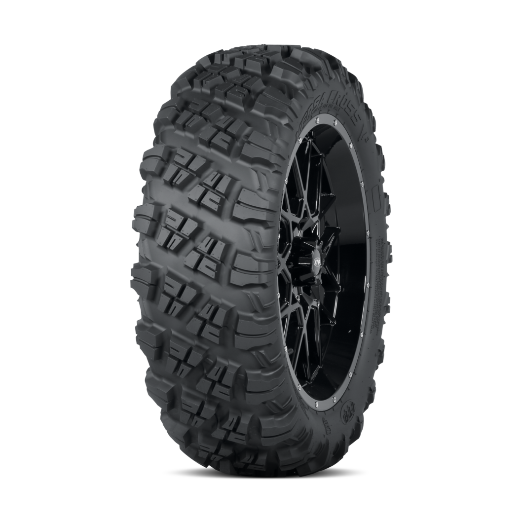 ITP Versa Cross V3 UTV tire with aggressive blocky tread pattern on black multi-spoke wheel