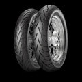 Pirelli Night Dragon GT rear cruiser tire on chrome spoked wheel showing asymmetric street tread pattern