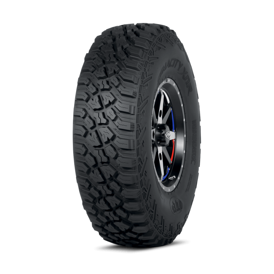 ITP Tenacity XNR UTV tire with aggressive all-terrain tread and raised lettering on black sidewall