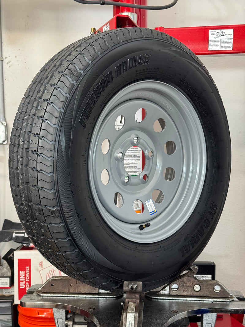 ST205/75R15 10-Ply Trailer Tire on 15" 5-4.5 Silver Modular Wheel