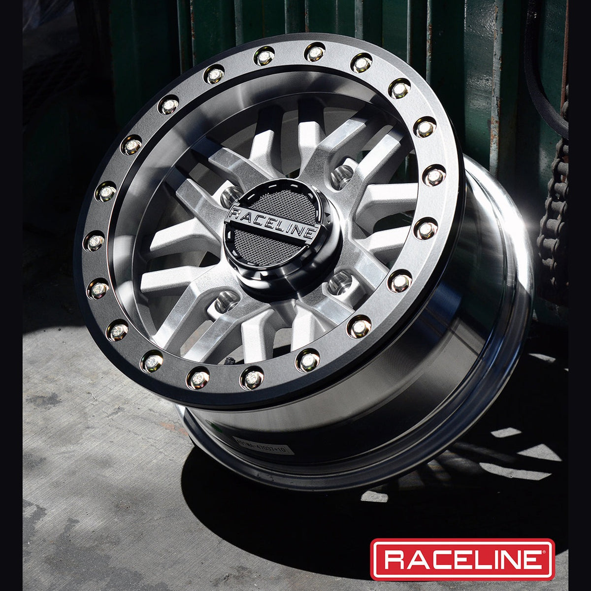 Raceline Ryno beadlock wheel on concrete ground with machined silver face and black ring