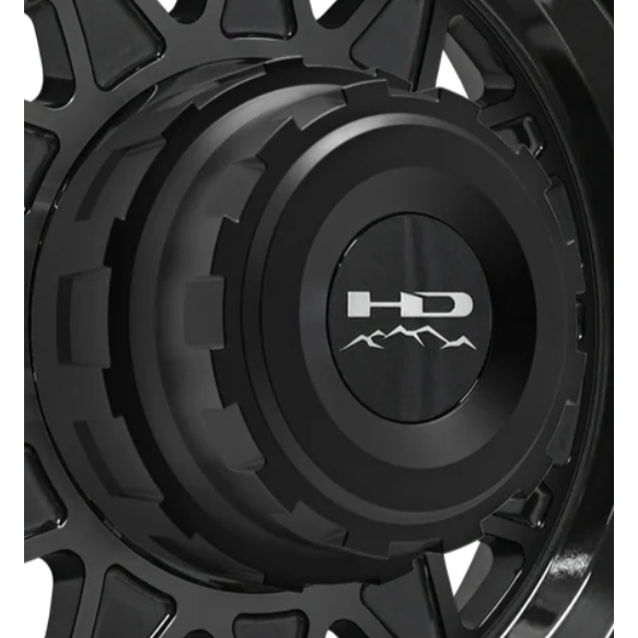 Black HD hub centric center cap with rugged stepped design and mountain logo