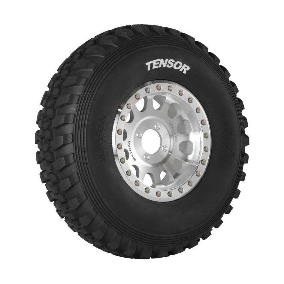 Tensor Desert Series DS UTV tire mounted on silver multi-spoke wheel with DOT markings