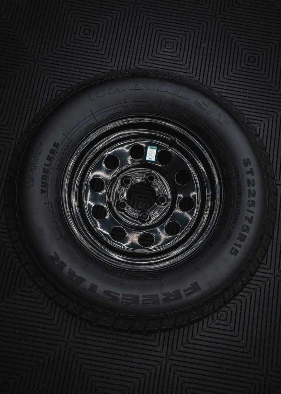ST225/75R15 10 - Ply Trailer Tire on 15" 5 - 4.5 Black Modular Wheel - Tires Fast